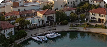 A picturesque coastal view of Santa Barbara with boats in the harbor, highlighting the serene coastal charm of Santa Barbara.