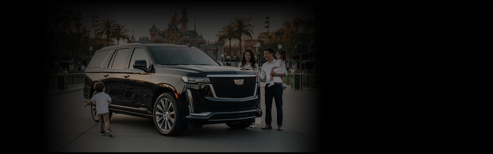 A happy family standing by a black Cadillac Escalade SUV outside Disneyland Theme Park.